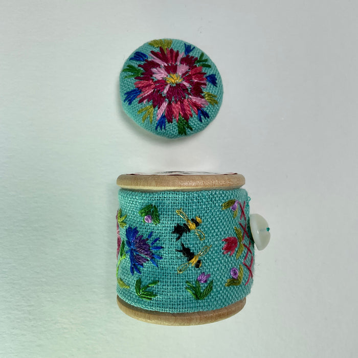 Turquoise floral cotton reel and button ( LW338)