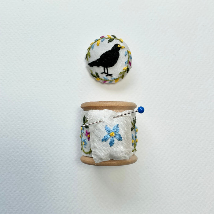Blackbird & Forget-me-not embroidered cotton reel with button and pin cushion( LW352)