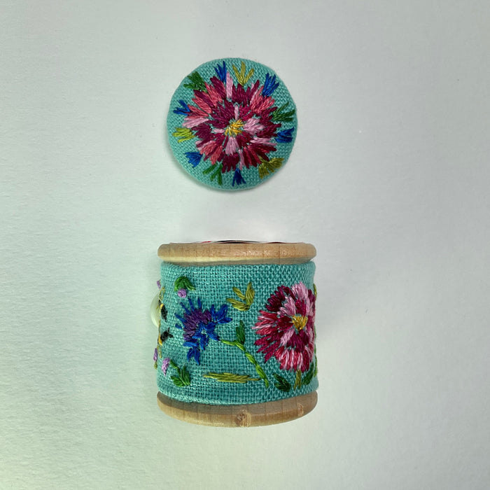 Turquoise floral cotton reel and button ( LW338)