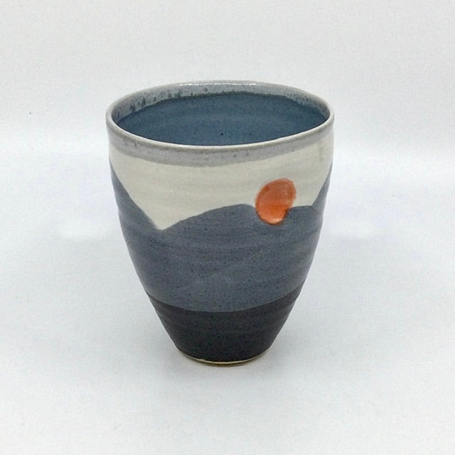 Thumb beaker, satin black/white/blue glaze, grey rim, orange spot (TL5
