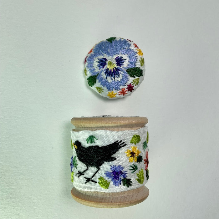 Black bird and Pansy cotton reel with button ( LW337)