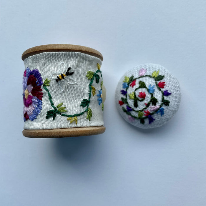 Embroidered cotton reel with button (LW254)