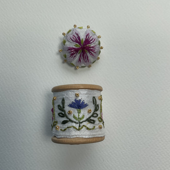 Floral cotton reel with pincushion on the back and button (LW355)