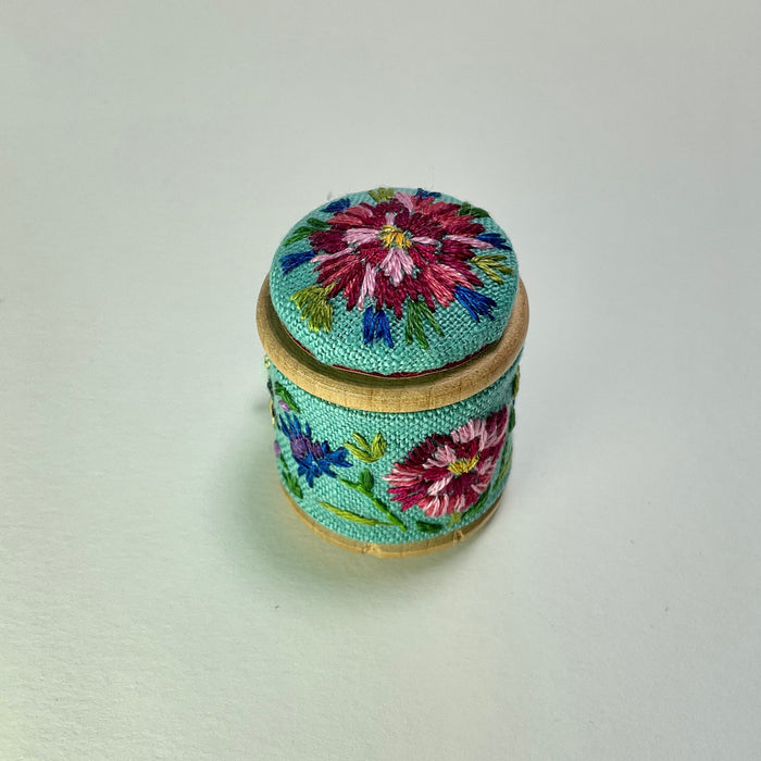 Turquoise floral cotton reel and button ( LW338)